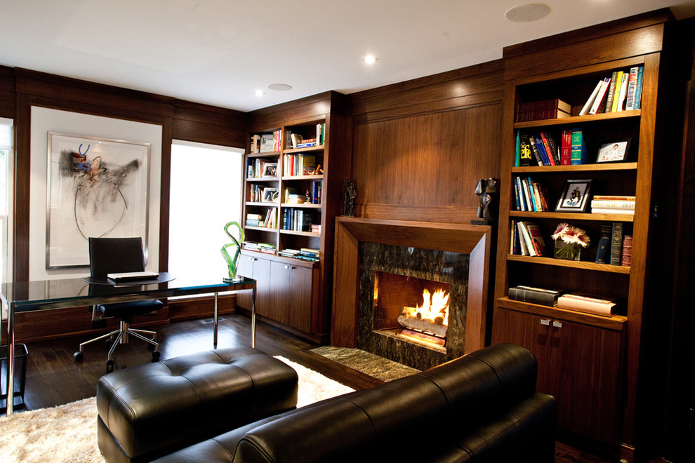 Trendy home office photo in Toronto with a stone fireplace and a standard fireplace