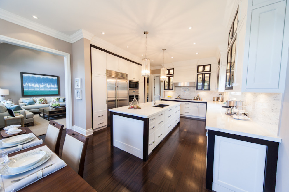 Kitchen - mid-sized transitional l-shaped dark wood floor and brown floor kitchen idea in Toronto with an undermount sink, shaker cabinets, white cabinets, quartz countertops, multicolored backsplash, quartz backsplash, stainless steel appliances, an island and multicolored countertops