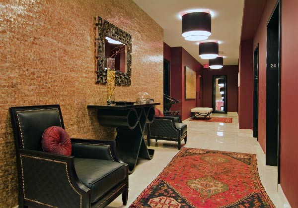 Mid-sized mountain style marble floor hallway photo in Chicago with orange walls