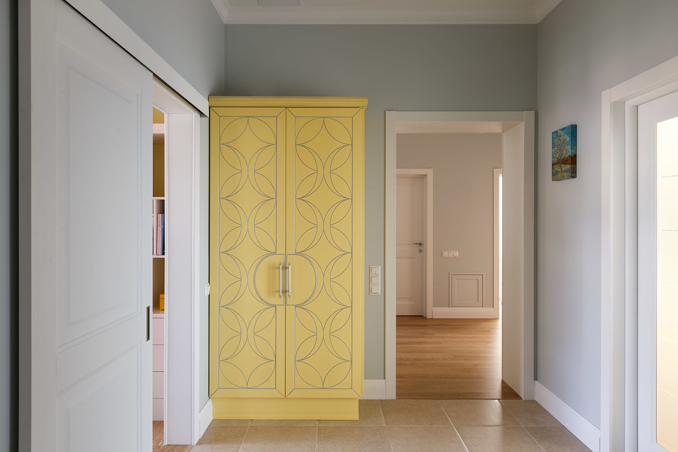 Photo of a mid-sized transitional hallway in Saint Petersburg with grey walls, porcelain floors and beige floor.
