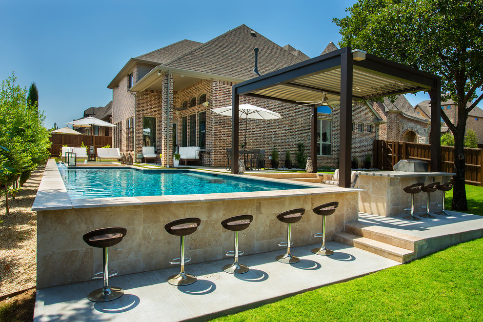 Inspiration for a mid-sized traditional backyard rectangular lap pool in Dallas with a hot tub and concrete slab.
