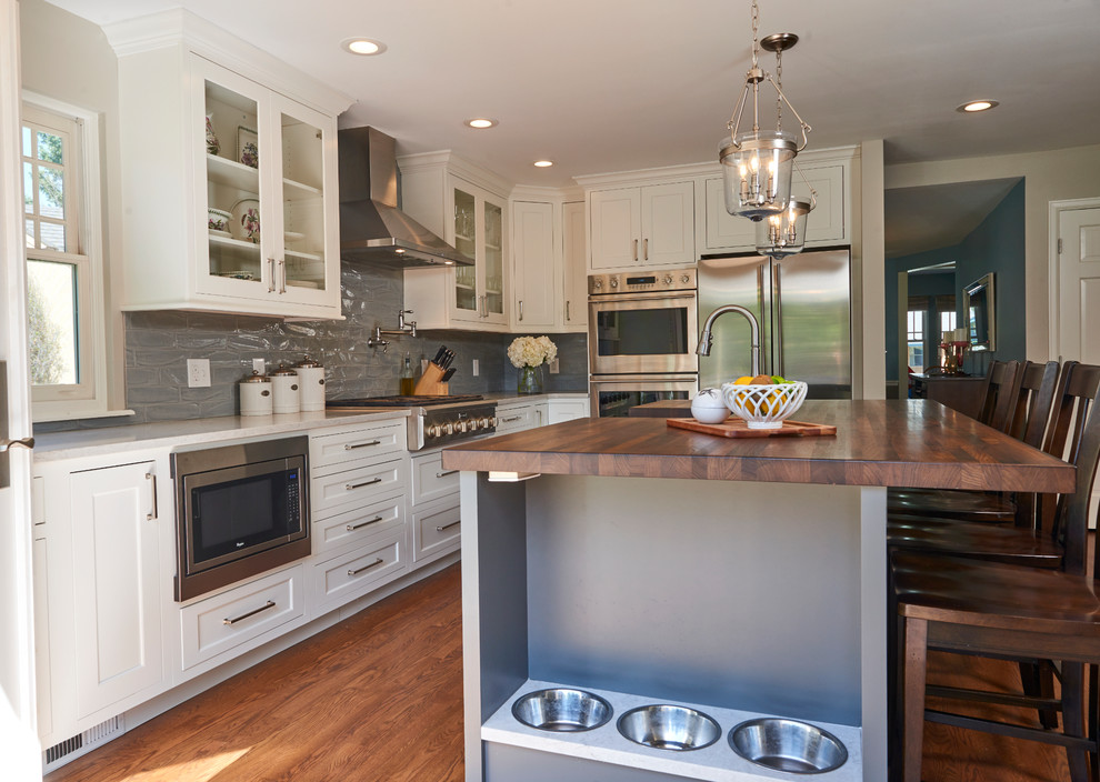 Example of a transitional kitchen design in Denver