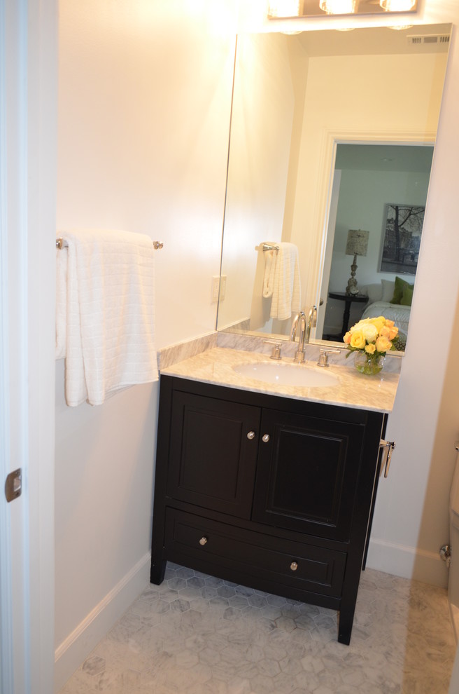 This is an example of a mid-sized traditional 3/4 bathroom in Los Angeles with raised-panel cabinets, white cabinets, a freestanding tub, an alcove shower, a one-piece toilet, gray tile, slate, grey walls, ceramic floors, an undermount sink, wood benchtops, multi-coloured floor, a hinged shower door and white benchtops.