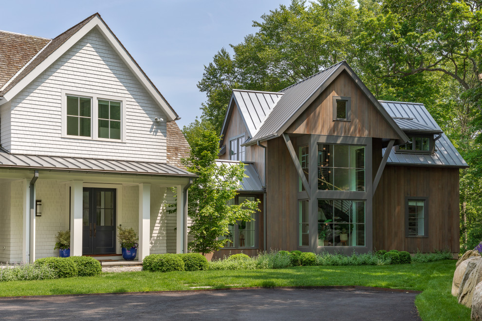 Huge transitional white two-story wood and shingle gable roof idea with a mixed material roof and a gray roof