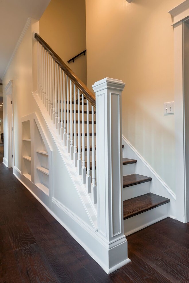 Design ideas for a mid-sized country wood l-shaped staircase in Other with painted wood risers and wood railing.