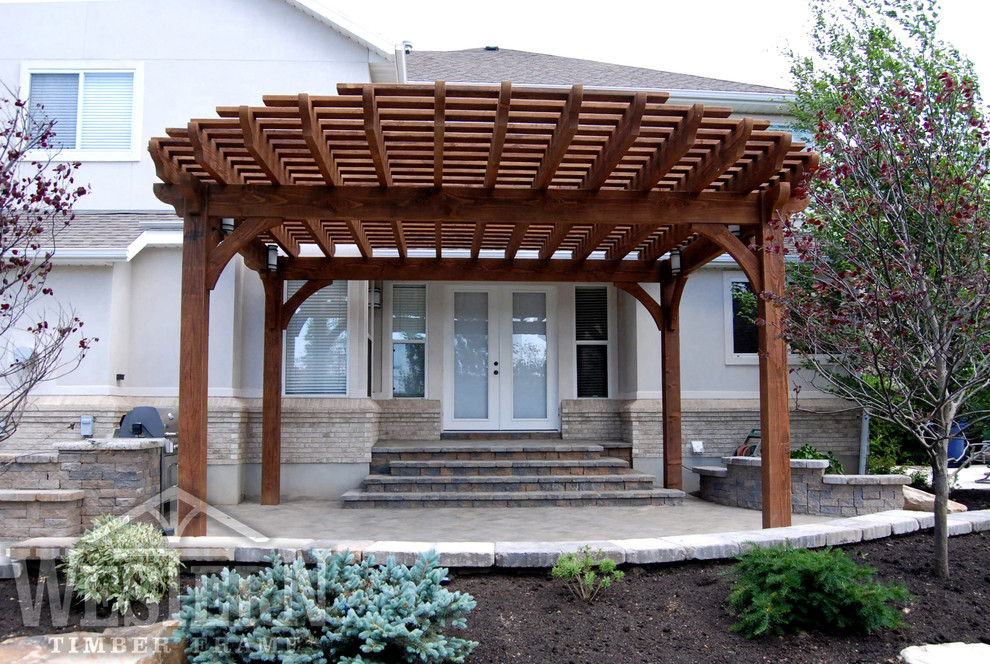 Photo of a traditional patio in Salt Lake City with a pergola.