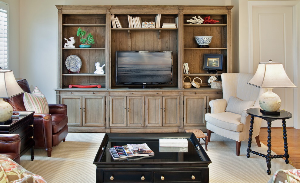 Design ideas for a traditional living room in Charleston with a freestanding tv.