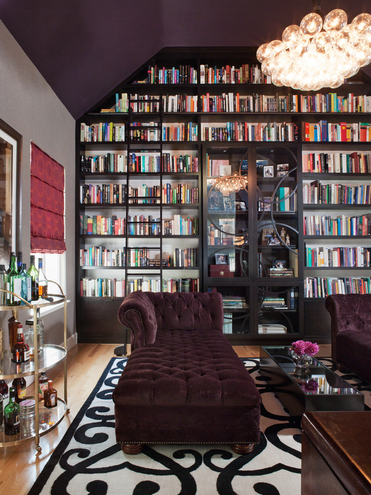 Inspiration for a contemporary family room in San Francisco with a library and medium hardwood floors.