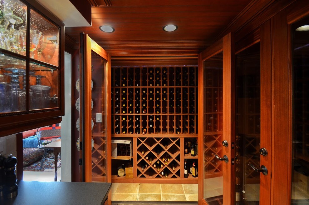Inspiration for a small traditional wine cellar in New York with ceramic floors and storage racks.