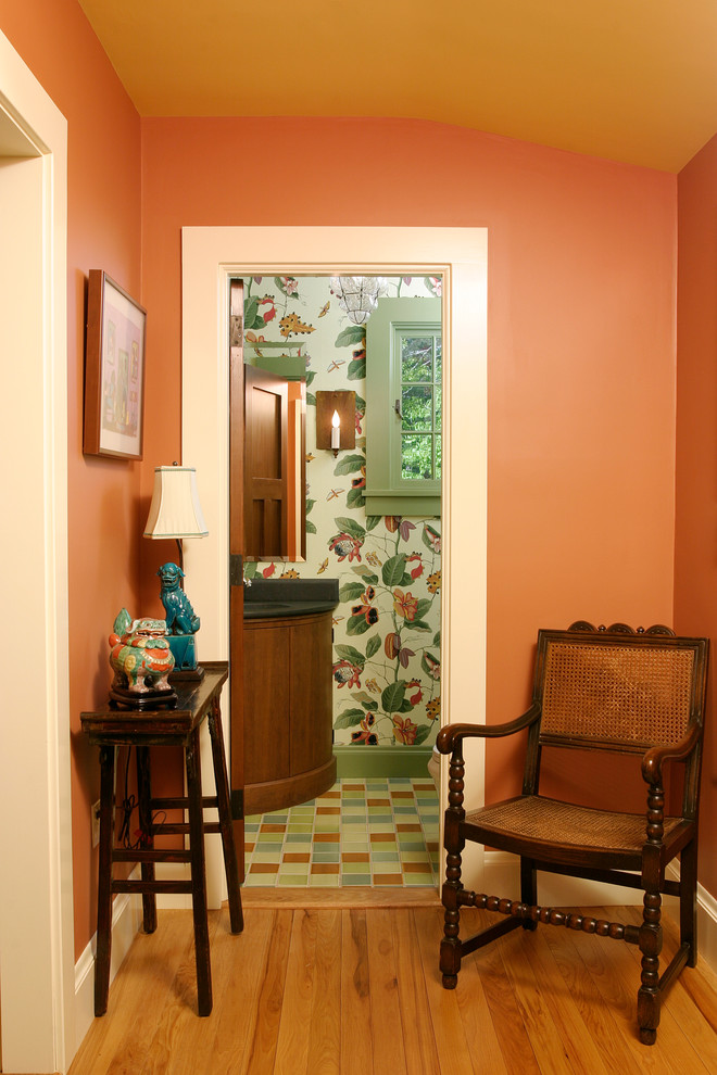Photo of a traditional powder room in Boston with medium wood cabinets.