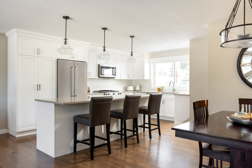 Example of a transitional home design design in Calgary