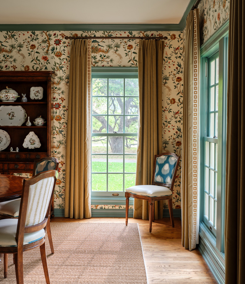 Photo of a traditional dining room in Austin with multi-coloured walls and wallpapered walls.