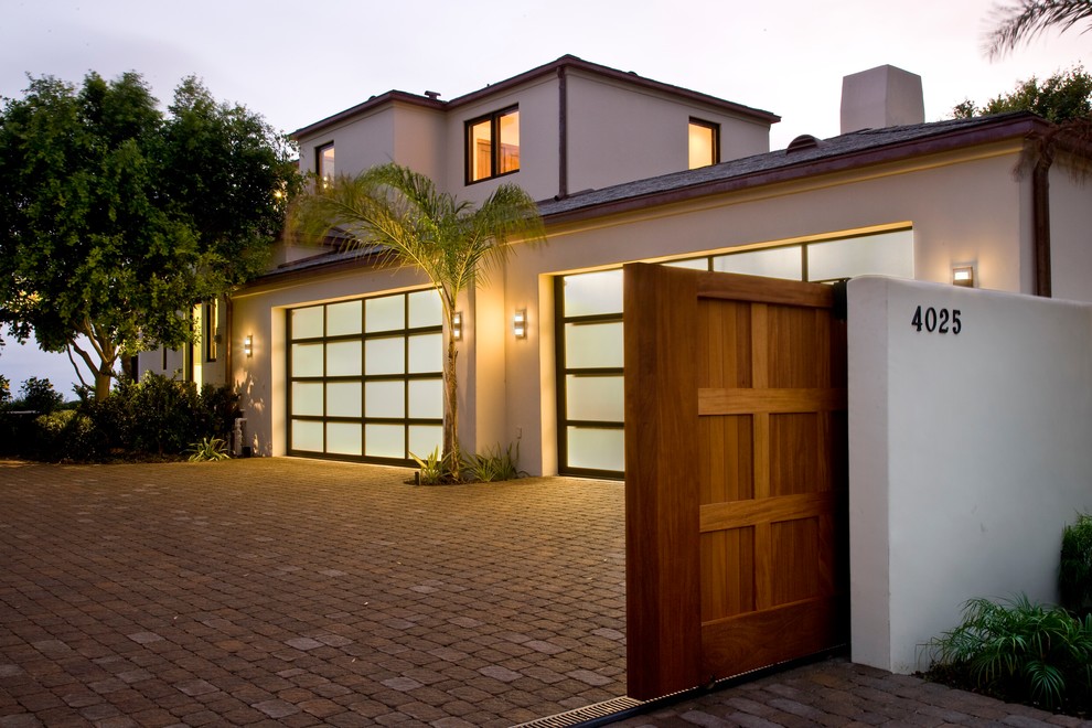Inspiration for a large tropical attached two-car garage in Santa Barbara.
