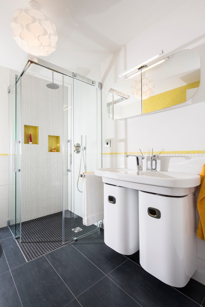 Inspiration for a mid-sized contemporary bathroom in Dortmund with a console sink, white cabinets, a curbless shower, a two-piece toilet, gray tile, ceramic tile, white walls and ceramic floors.