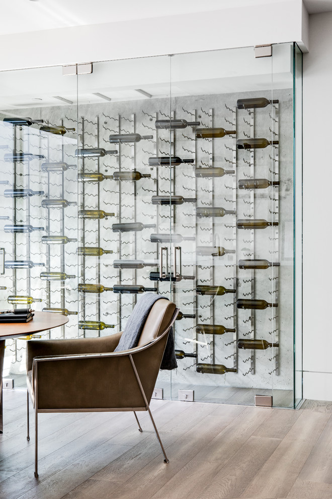 Photo of a mid-sized contemporary wine cellar in Los Angeles with display racks.