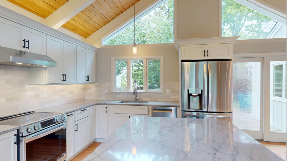 A kitchen with a high ceiling