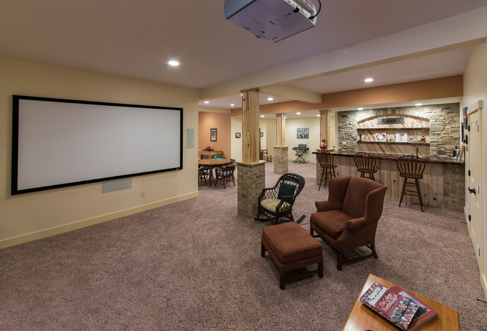 Mid-sized country home theatre in Other with beige walls, carpet and grey floor.
