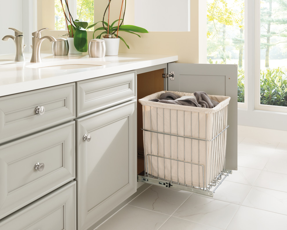 Elegant ceramic tile and white floor bathroom photo with recessed-panel cabinets, gray cabinets, beige walls and white countertops