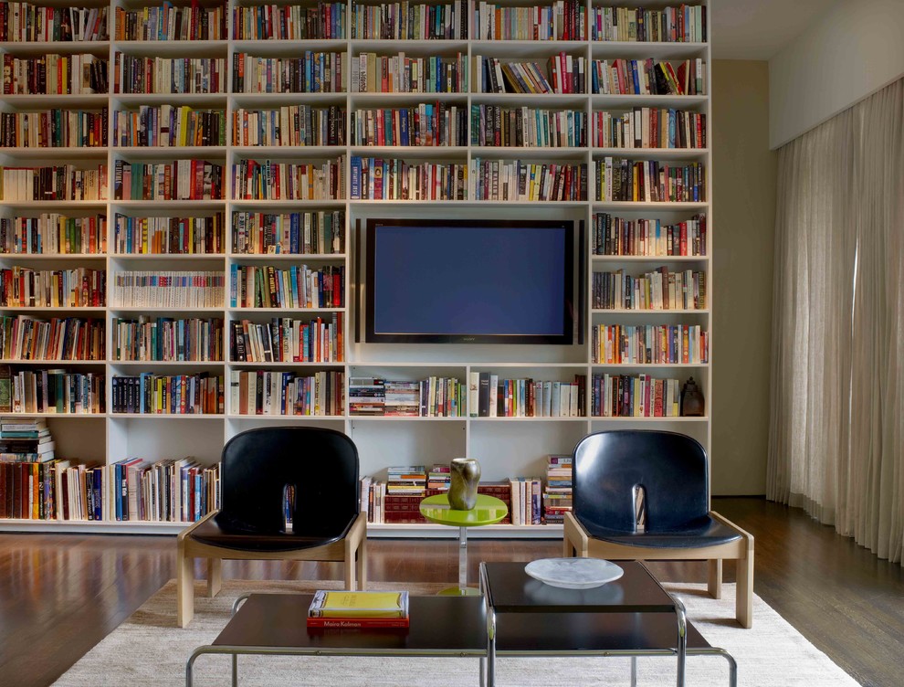 Photo of a modern family room in Houston with a library.