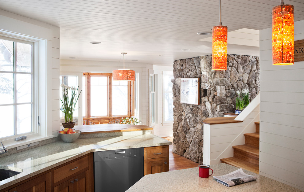 Inspiration for a traditional u-shaped eat-in kitchen in Portland Maine with recycled glass benchtops, an undermount sink, shaker cabinets, medium wood cabinets and stainless steel appliances.