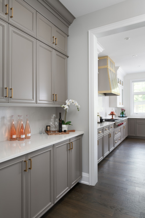 Light Beige Kitchen Cabinetry with Oval Brass Knobs - Transitional - Kitchen