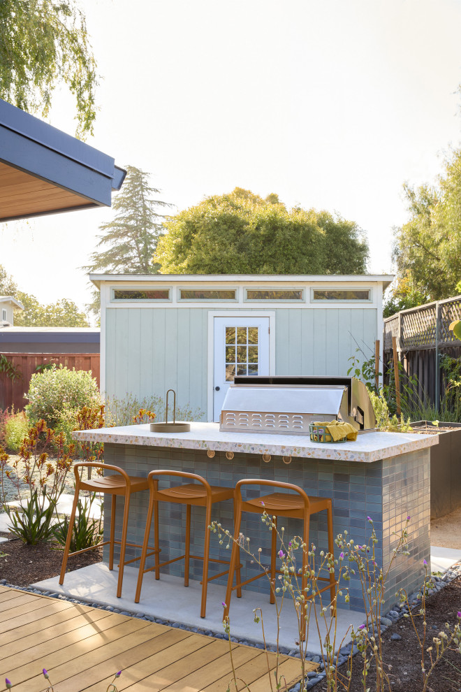 Inspiration for a mid-sized 1960s backyard concrete patio remodel in San Francisco with a bbq area and no cover