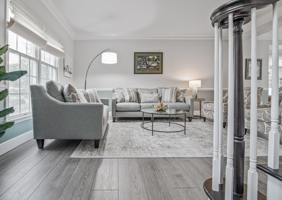 Photo of a large modern formal open concept living room in New York with grey walls, vinyl floors and grey floor.