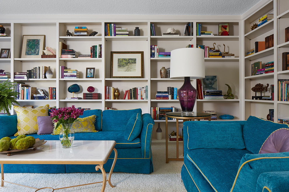 Inspiration for a mid-sized eclectic open concept family room in Minneapolis with a library, white walls, carpet, no fireplace and no tv.