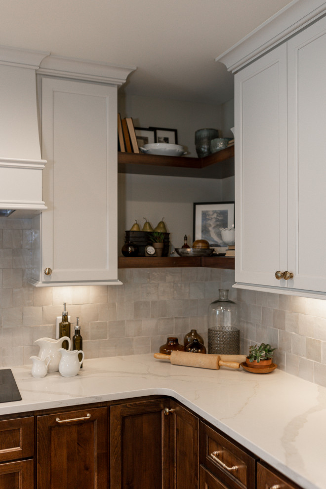 Inspiration for a mid-sized transitional l-shaped medium tone wood floor and brown floor eat-in kitchen remodel with an undermount sink, recessed-panel cabinets, medium tone wood cabinets, quartz countertops, beige backsplash, terra-cotta backsplash, stainless steel appliances, an island and white countertops