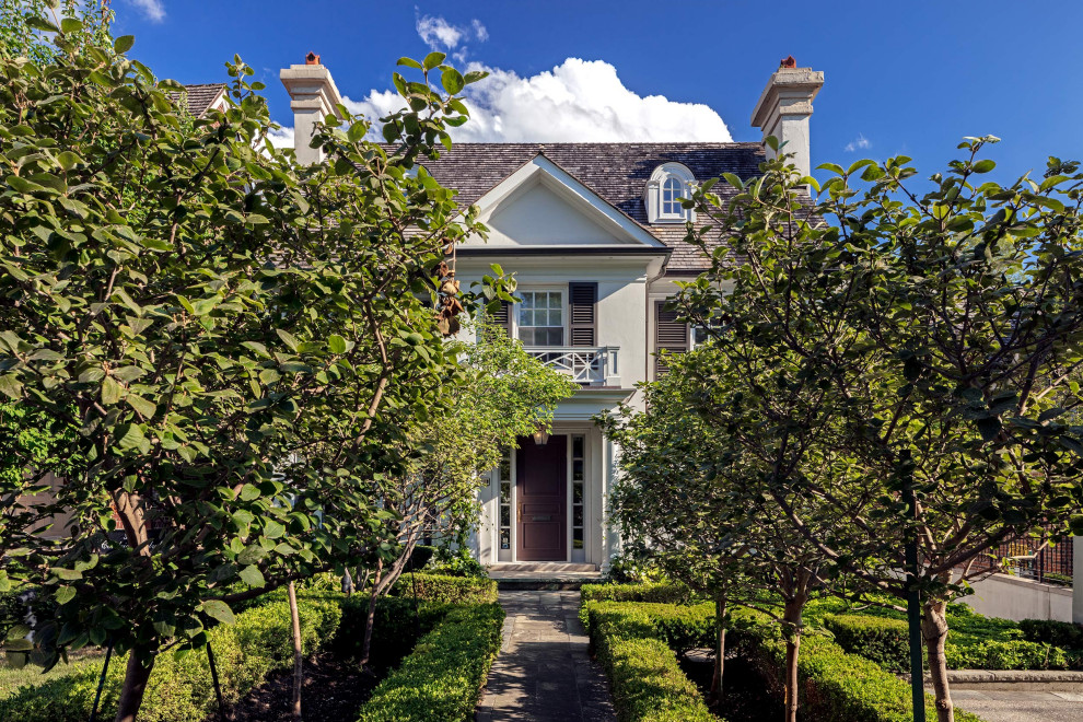 Inspiration for a large transitional gray three-story stucco gable roof remodel in Toronto with a shingle roof and a gray roof