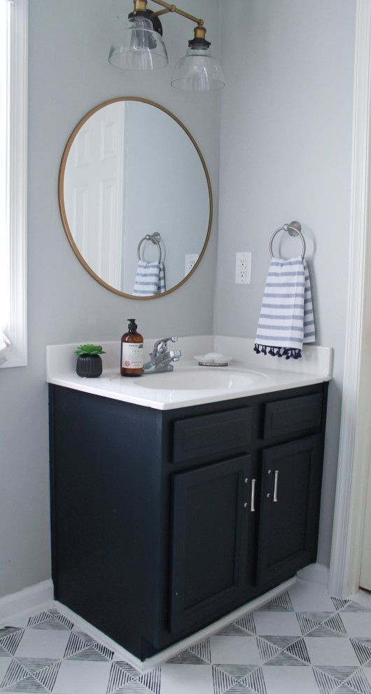 Inspiration for a small coastal kids' mosaic tile floor and single-sink bathroom remodel in Other with shaker cabinets, blue cabinets, a two-piece toilet, gray walls, a drop-in sink, quartz countertops, white countertops and a built-in vanity