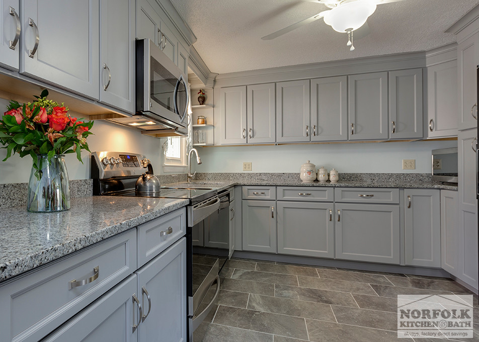 Example of a mid-sized transitional u-shaped home design design in Boston with an undermount sink, shaker cabinets, gray cabinets, granite countertops, stainless steel appliances and no island