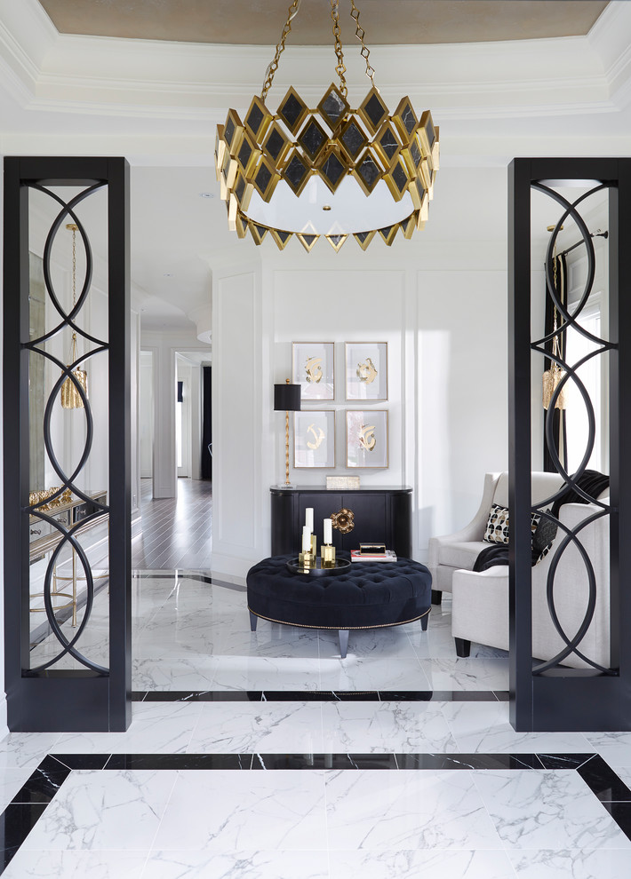 Foyer - mid-sized transitional porcelain tile and white floor foyer idea in Toronto with white walls