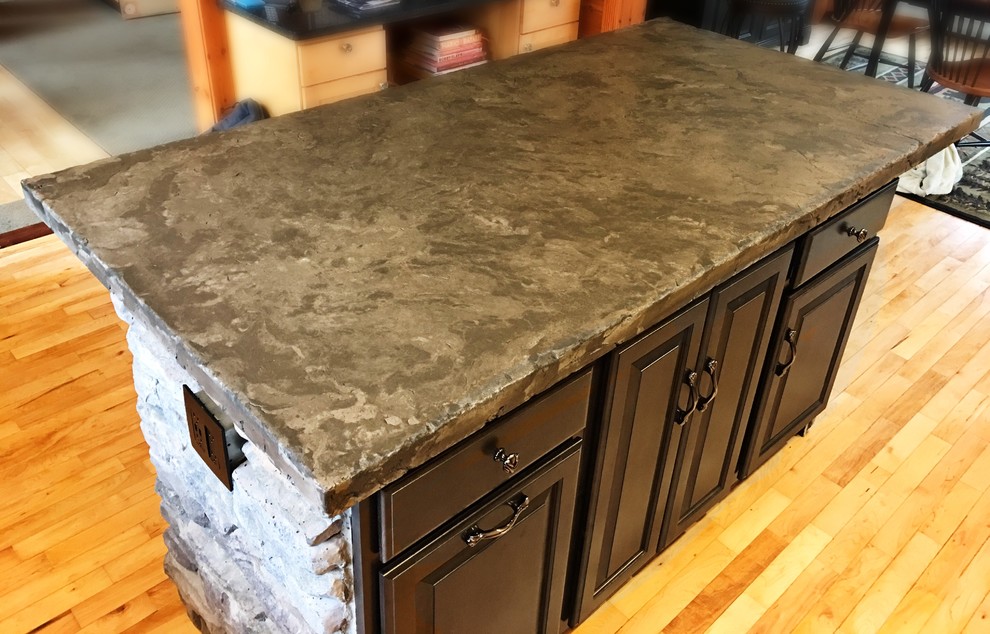Inspiration for a rustic kitchen remodel in New York with concrete countertops