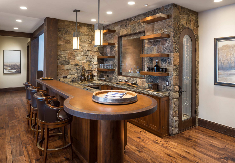 Inspiration for a country u-shaped seated home bar in Other with open cabinets, dark wood cabinets, stone tile splashback, brown floor and medium hardwood floors.