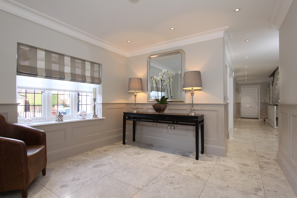 This is an example of a contemporary hallway in London with grey walls.