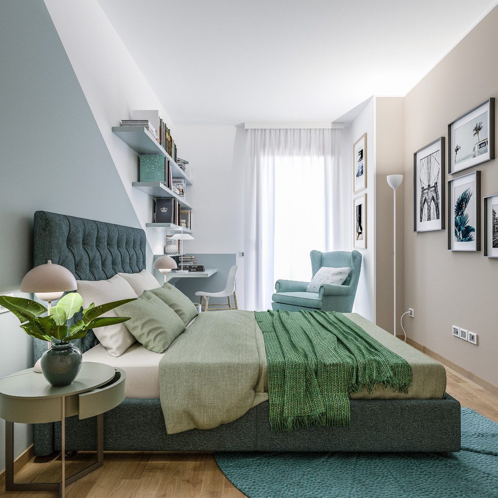 This is an example of a small scandinavian master bedroom in Milan with multi-coloured walls and light hardwood floors.