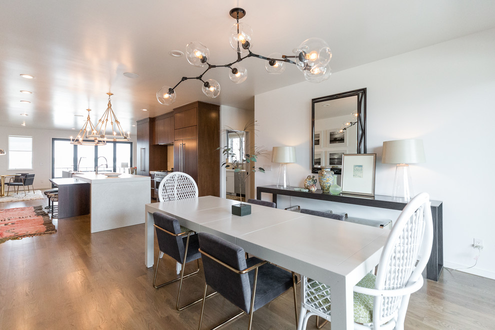 Mid-sized modern open plan dining in Wilmington with white walls and medium hardwood floors.