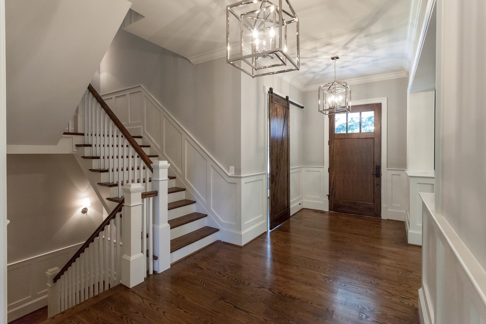Transitional medium tone wood floor and brown floor home design photo in DC Metro with gray walls and a medium wood front door
