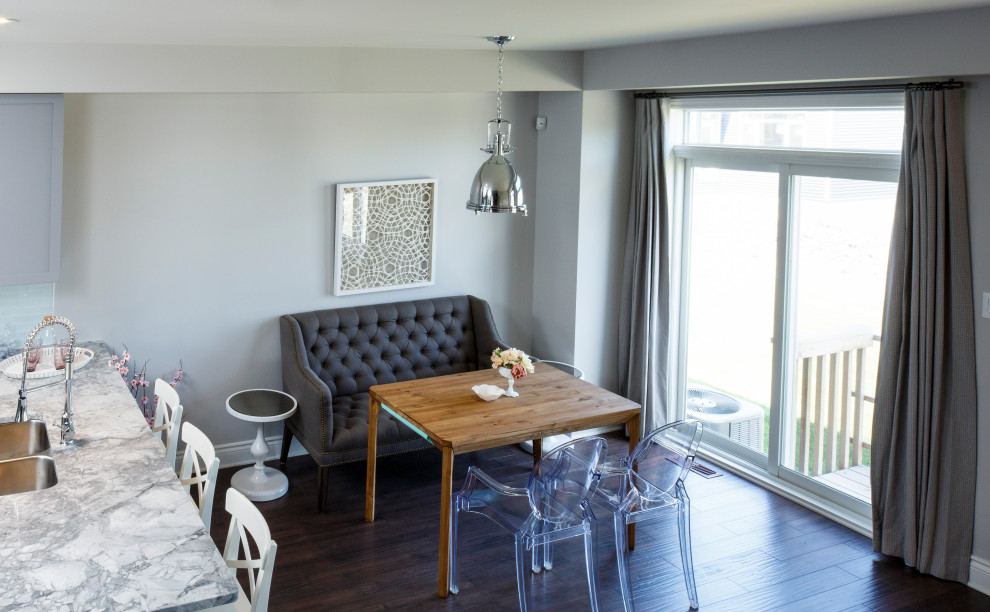 This is an example of a small transitional dining room in Ottawa with grey walls, dark hardwood floors and brown floor.