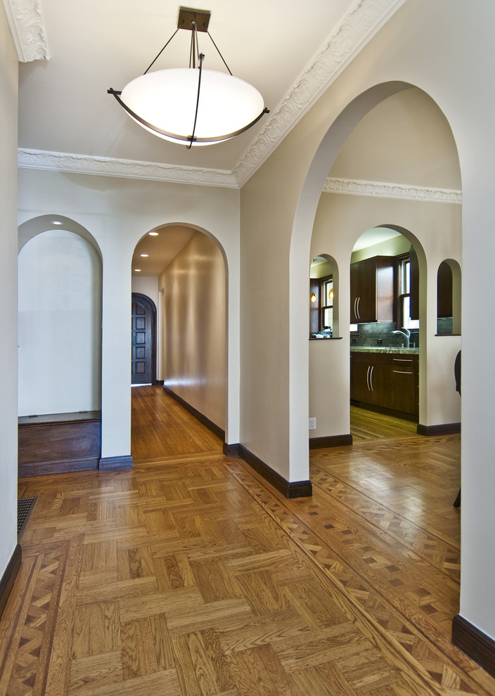 Photo of a transitional entryway in San Francisco with beige walls and medium hardwood floors.