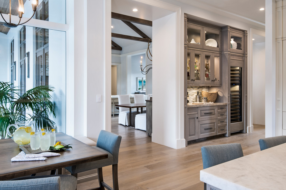 Inspiration for a transitional light wood floor open concept kitchen remodel with stainless steel appliances and an island