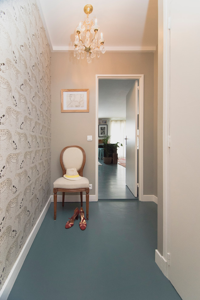Photo of a transitional entryway in Paris with grey walls, painted wood floors and blue floor.