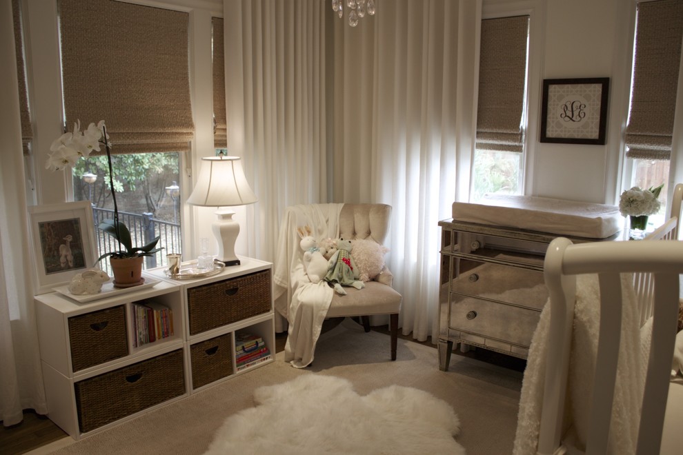Photo of a traditional nursery for girls in Dallas with dark hardwood floors.