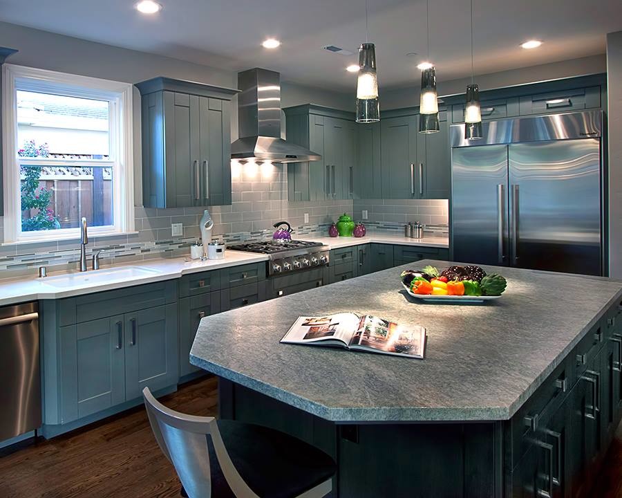This is an example of a mid-sized transitional l-shaped kitchen in San Francisco with an undermount sink, shaker cabinets, blue cabinets, granite benchtops, grey splashback, matchstick tile splashback, stainless steel appliances, dark hardwood floors and with island.