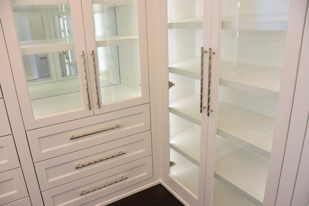 Inspiration for a large transitional women's walk-in wardrobe in Dallas with shaker cabinets, white cabinets, medium hardwood floors and brown floor.
