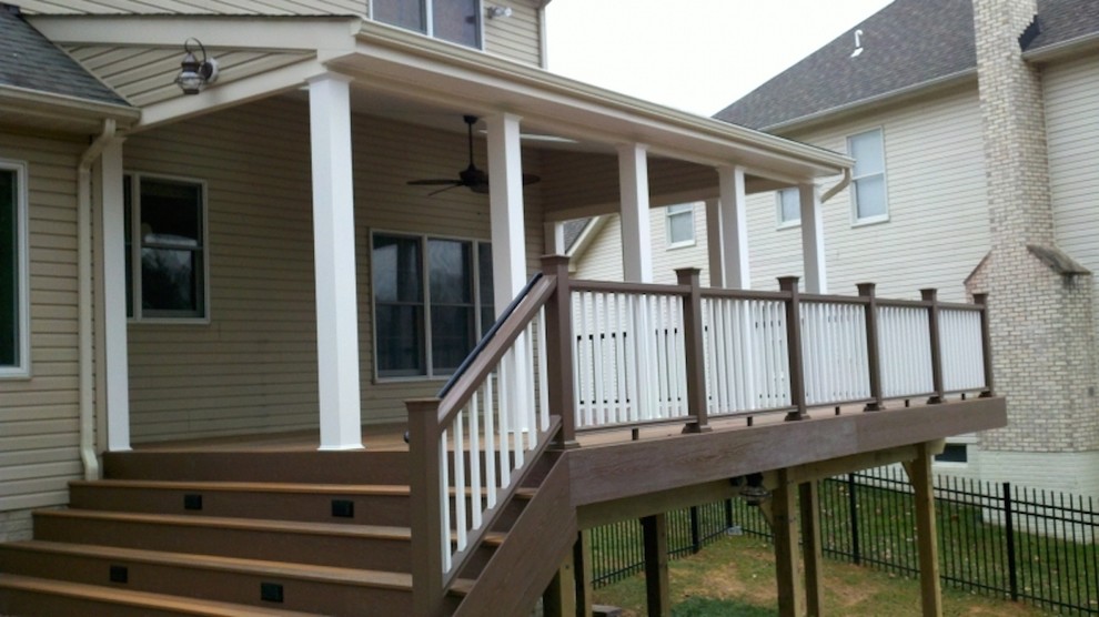 Example of a large transitional backyard deck design in Baltimore with no cover