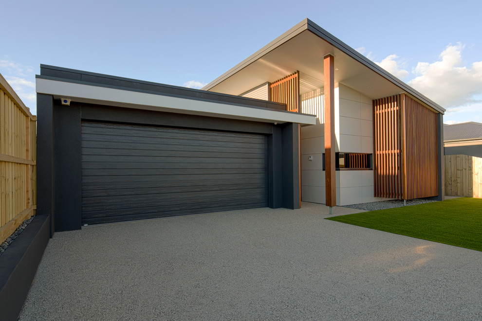 Inspiration for a mid-sized contemporary one-storey grey exterior in Geelong with concrete fiberboard siding and a shed roof.