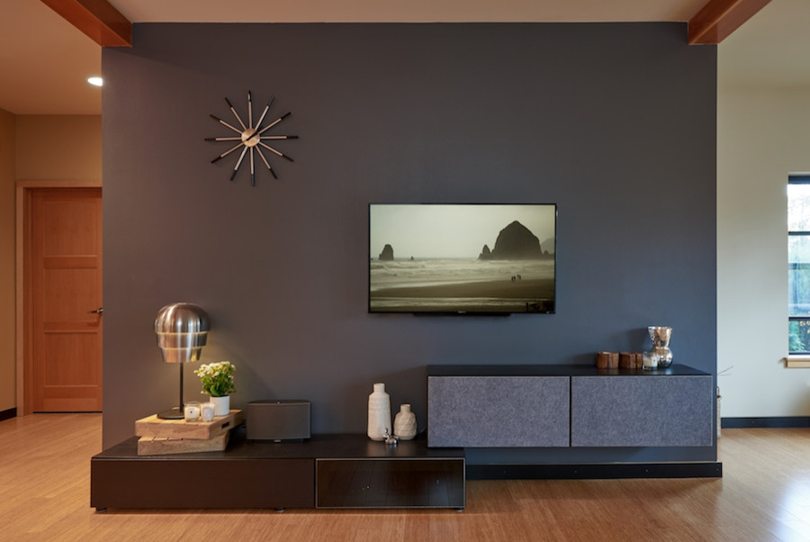 Design ideas for a mid-sized modern open concept living room in Seattle with black walls, bamboo floors and a wall-mounted tv.