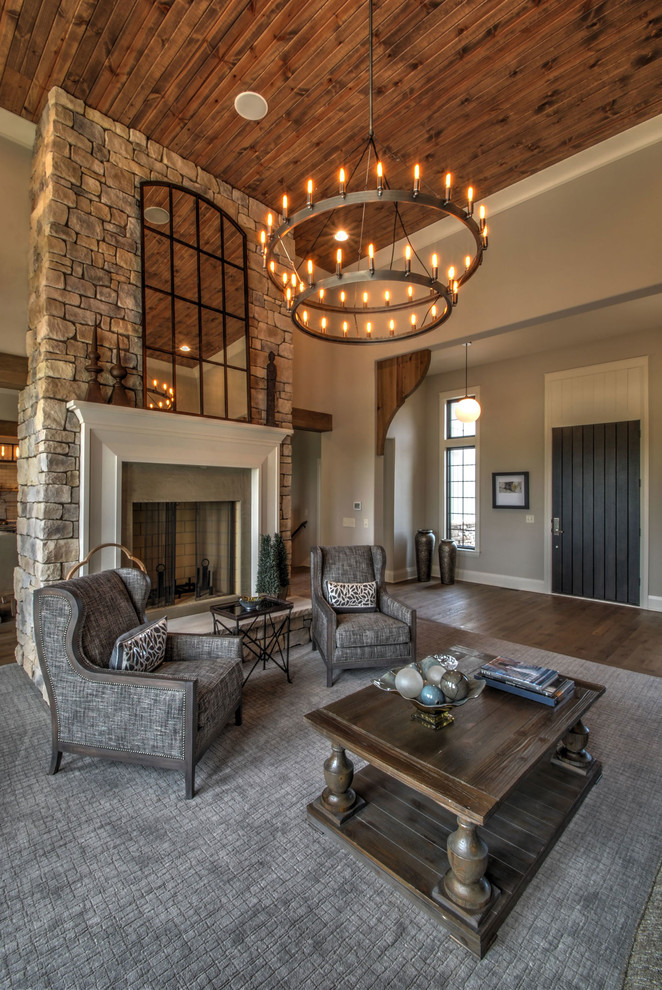 Inspiration for a large traditional open concept family room in Cleveland with a stone fireplace surround.
